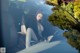 A woman sitting in the back seat of a car.